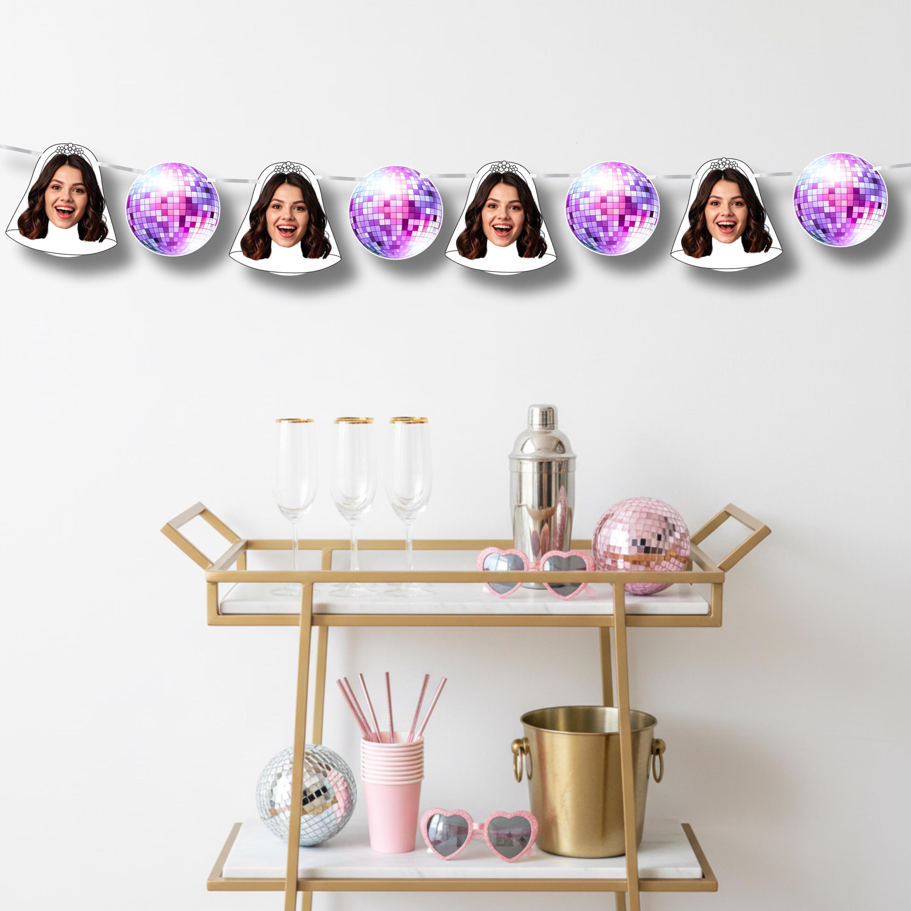 Decorative bar cart with disco ball accents and a person's face on a disco ball.