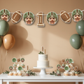 First Year Down football first birthday banner styled above a neutral dessert table with smash cake, cupcakes, and sage green and tan balloons. Custom photo football banner decor designed for a sports themed one year old birthday party celebration.