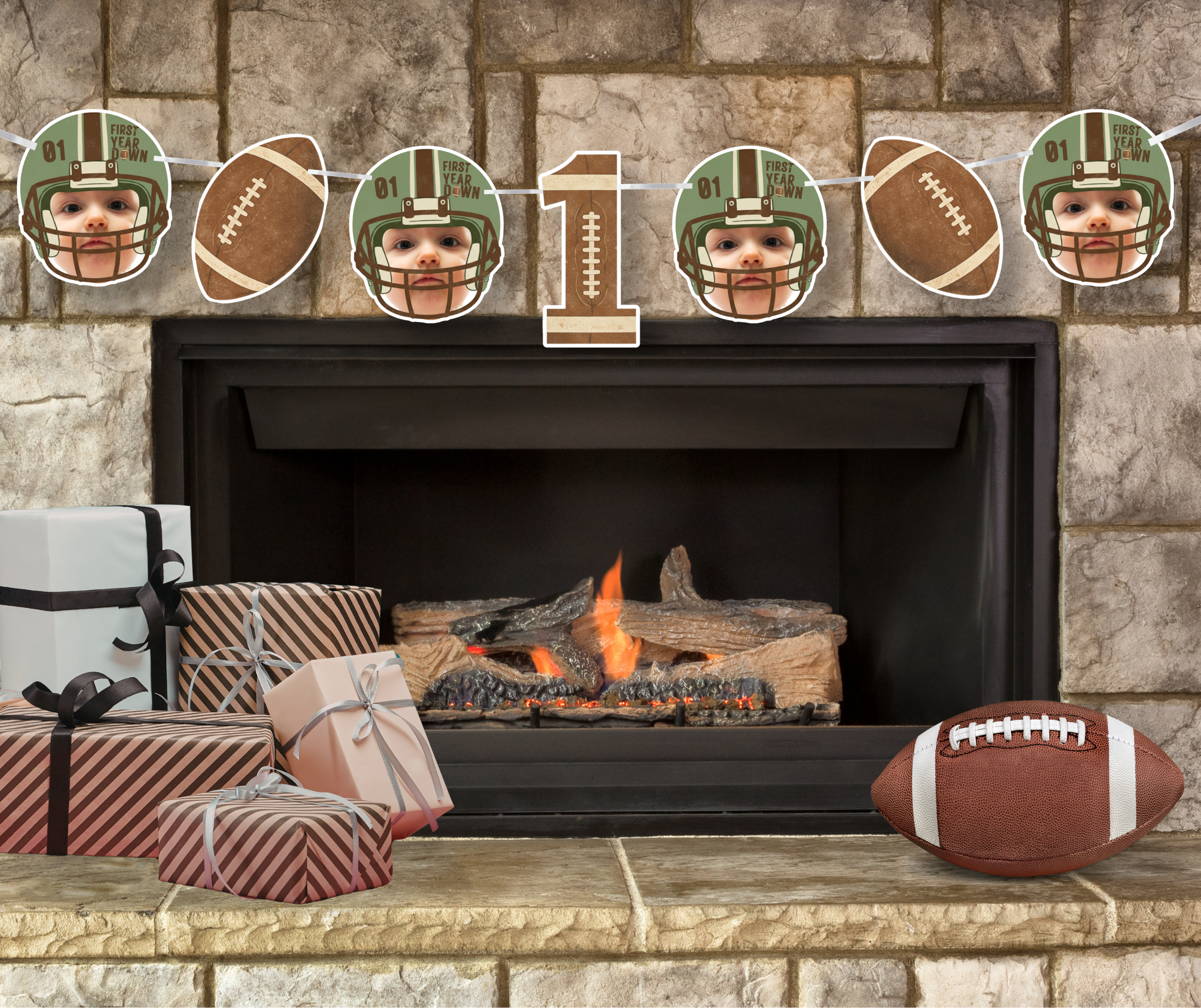 Personalized First Year Down football birthday banner displayed above a cozy fireplace with football decor and gift boxes, perfect for a rustic sports themed first birthday party setup. Vintage style football helmet photo cutouts and number one centerpiece create a warm game day inspired celebration backdrop.