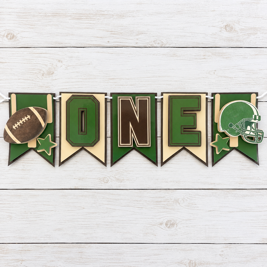 Full First Year Down football highchair banner laid flat with football helmet stars and ONE panels