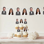 Cupcakes with face cutouts on a stand with decorative flowers on a light background