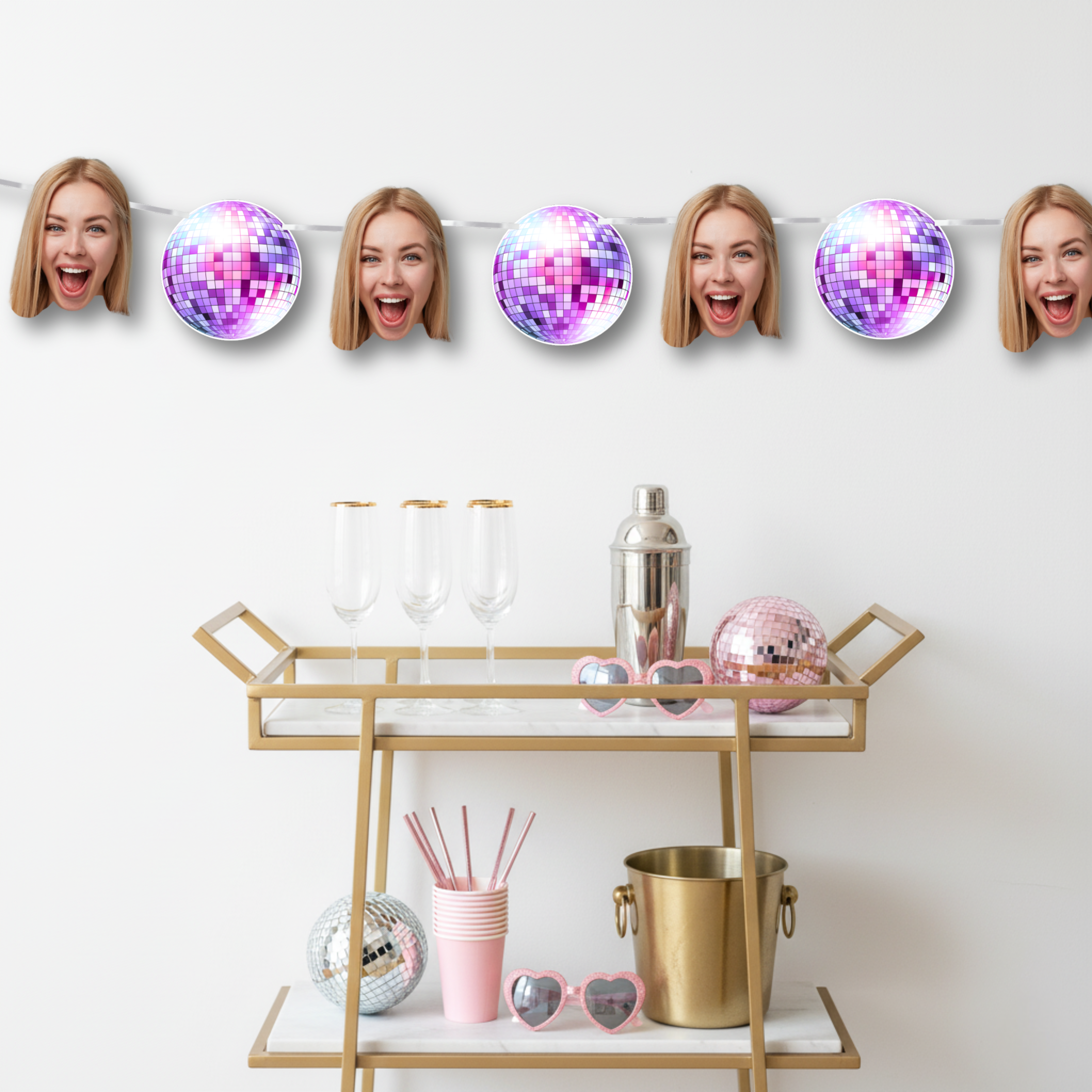 Bar cart with disco balls and faces on a white wall