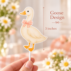 Close up of the goose cupcake topper with pink gingham bow for a One Silly Goose birthday, measuring approximately 3 inches.
