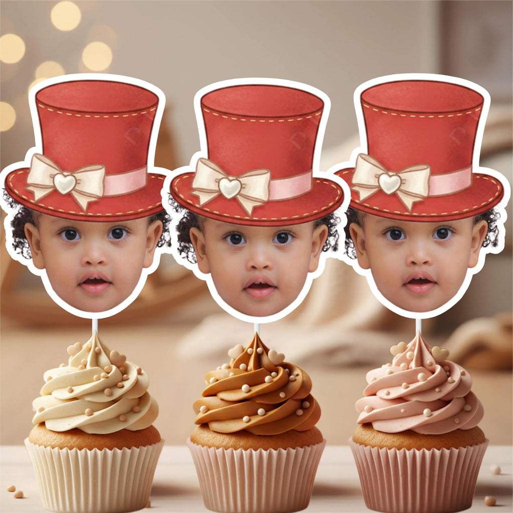 Three personalized cupcake toppers with children’s faces wearing red ringmaster top hats, styled on caramel and vanilla frosted cupcakes. Perfect for Greatest Showman birthday parties, circus carnival dessert tables, magician themes, and unisex milestone celebrations.