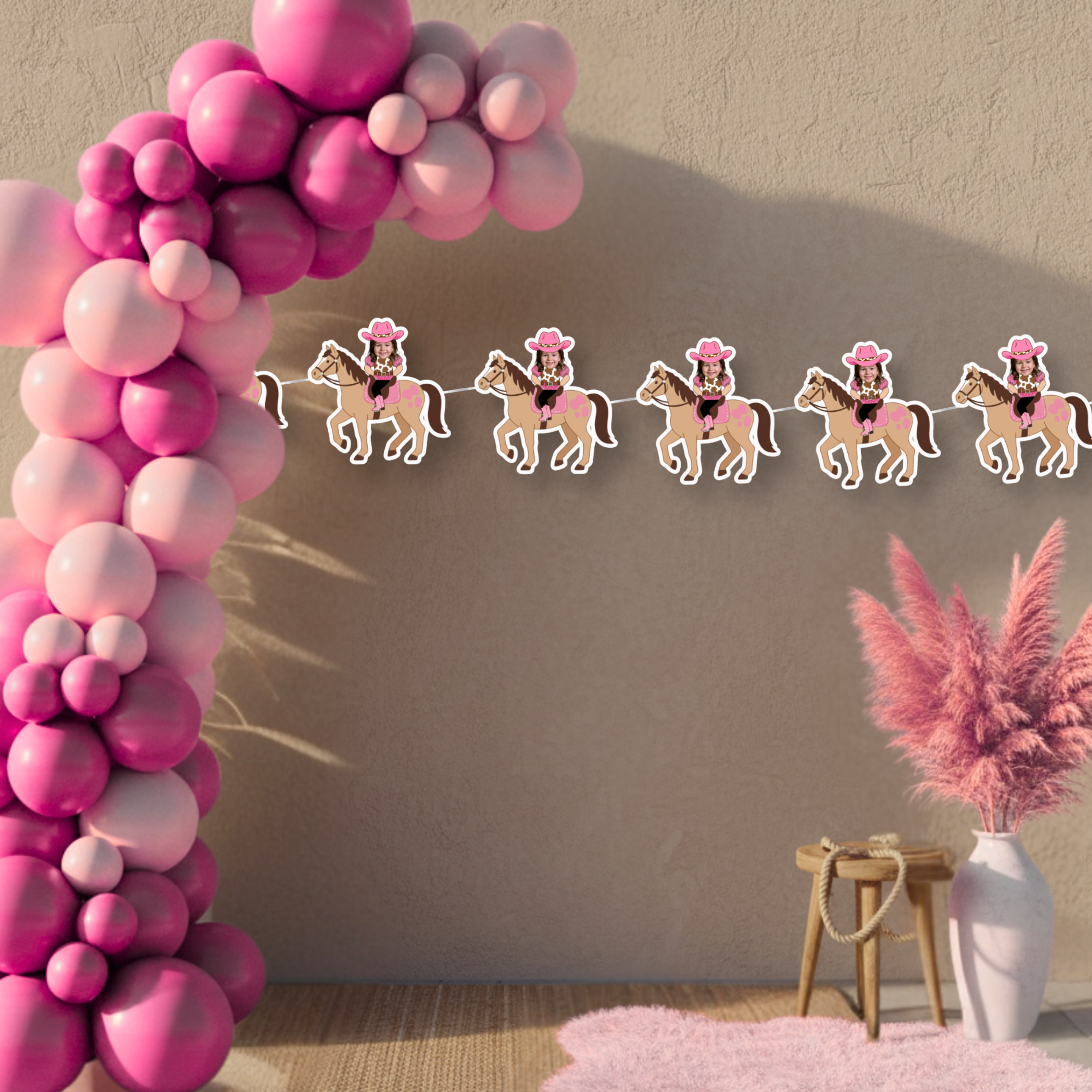 Hot pink cowgirl birthday banner with custom photo panels displayed beneath bold balloon arch for western themed birthday decor. Vibrant pink rodeo party styling featuring the My First Rodeo cowgirl photo banner as a high-impact western birthday backdrop.