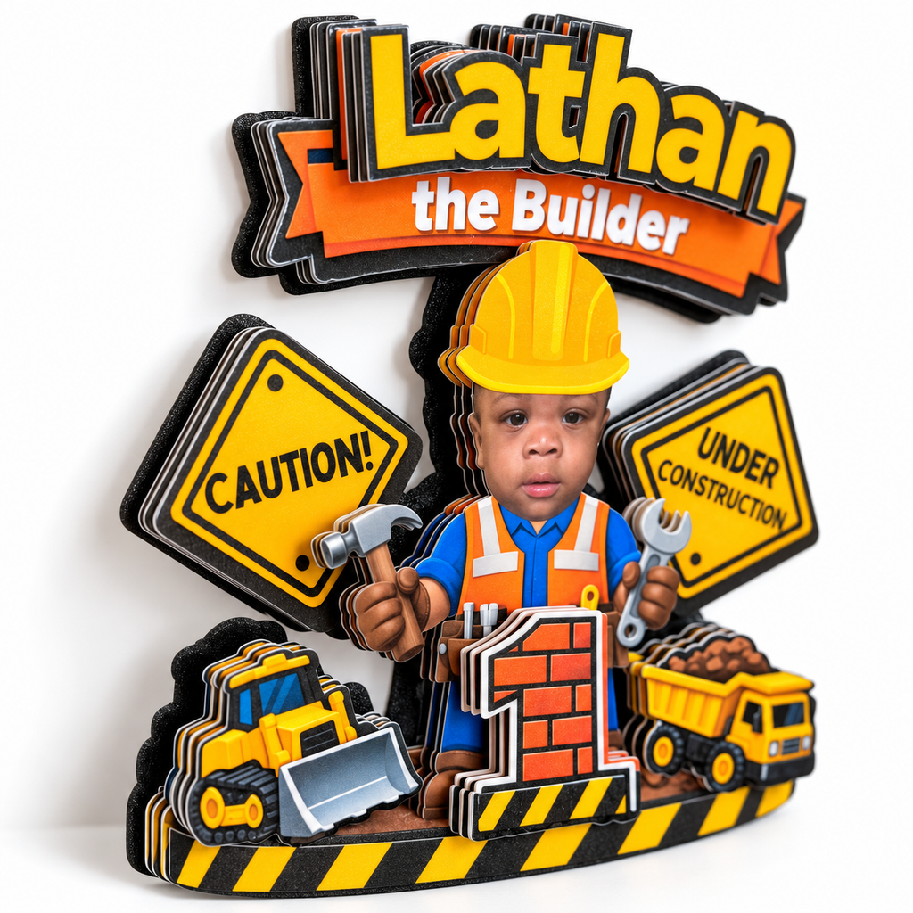 Close up angled view of a personalized construction cake topper showing the layered cardstock design with caution signs construction vehicles childs photo and age number