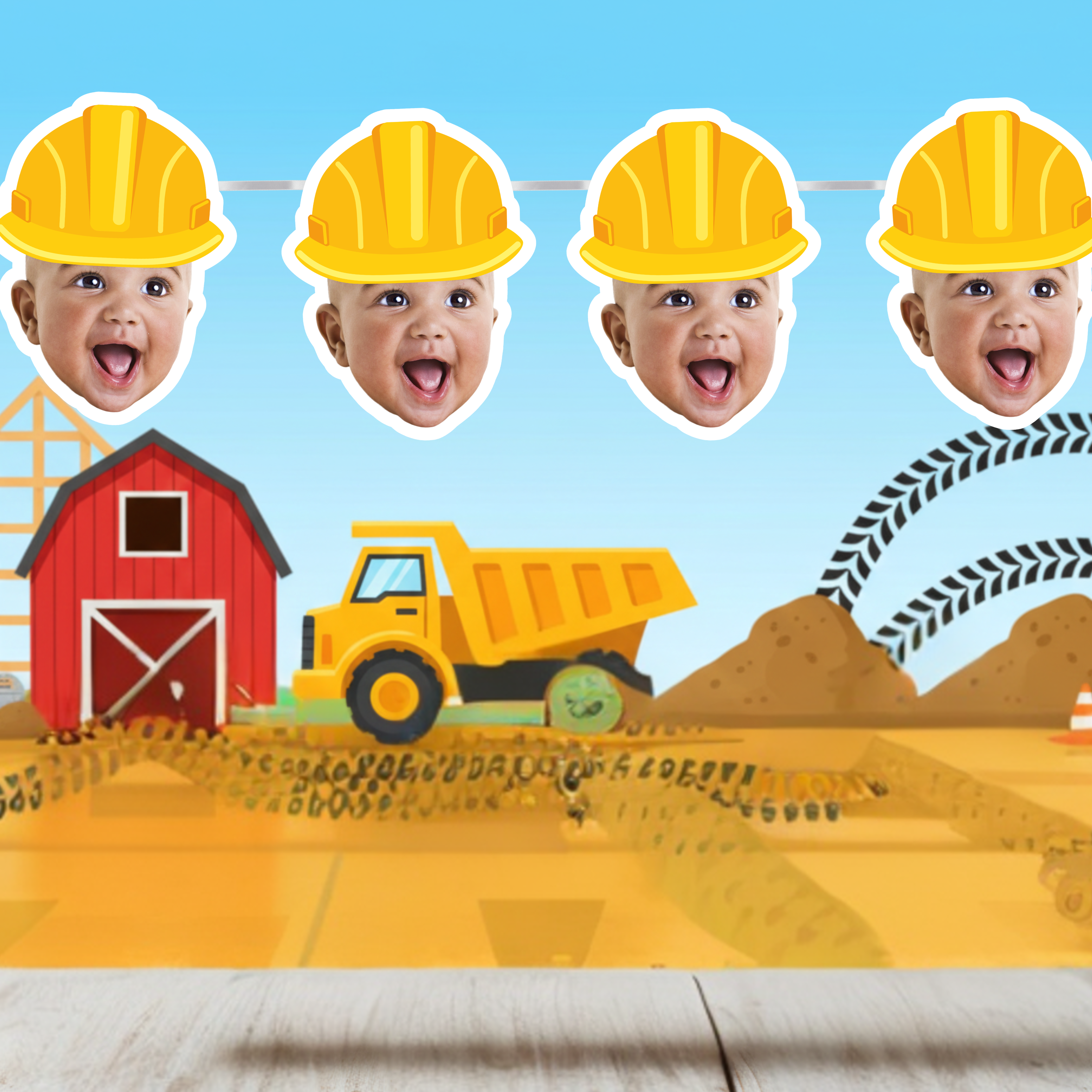 Children's photo booth with construction-themed props including a baby in a hard hat, a red barn, and a yellow dump truck.
