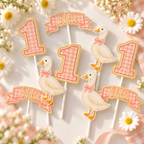 Flat lay of One Silly Goose cupcake toppers in pink gingham with personalized Chloe name banners, goose designs and custom number one toppers.