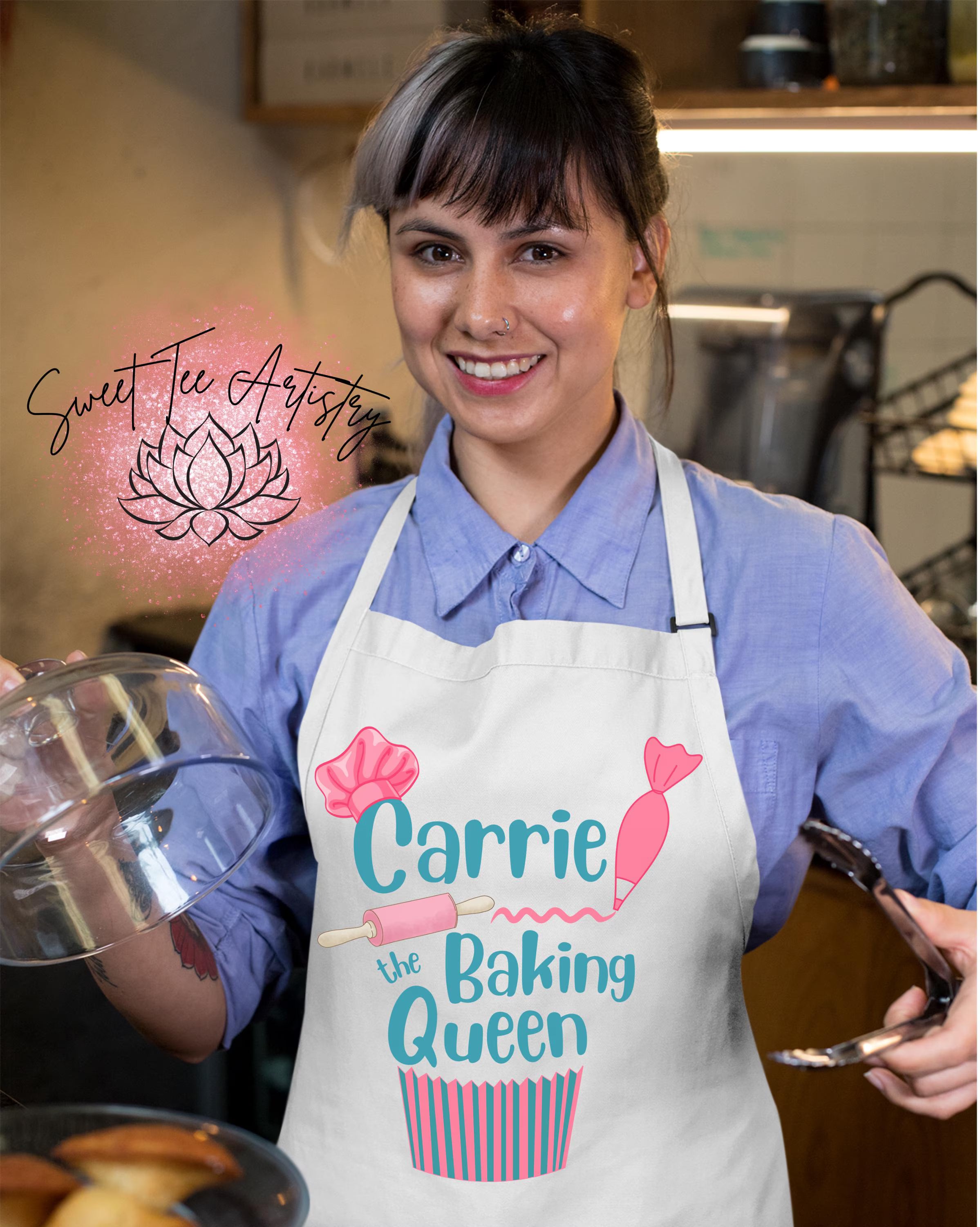 Woman wearing a 'Carrie the Baking Queen' apron in a kitchen setting.