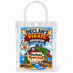 Close up of a personalized clear pirate birthday goodie bag with custom child name and age sticker, coloring book visible inside, and secure snap closure.