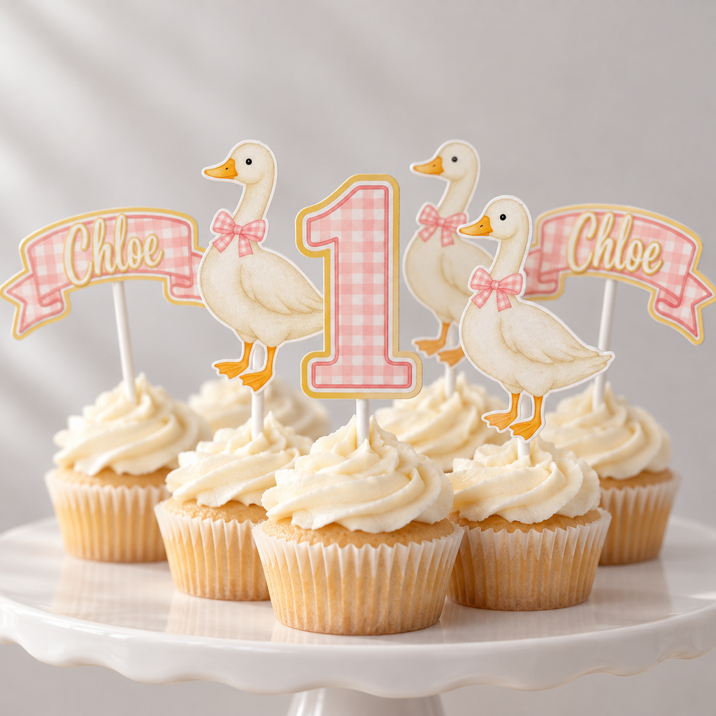 Pink gingham goose first birthday cupcake topper set styled on cupcakes with custom Chloe name banners, number one toppers and matching goose designs.