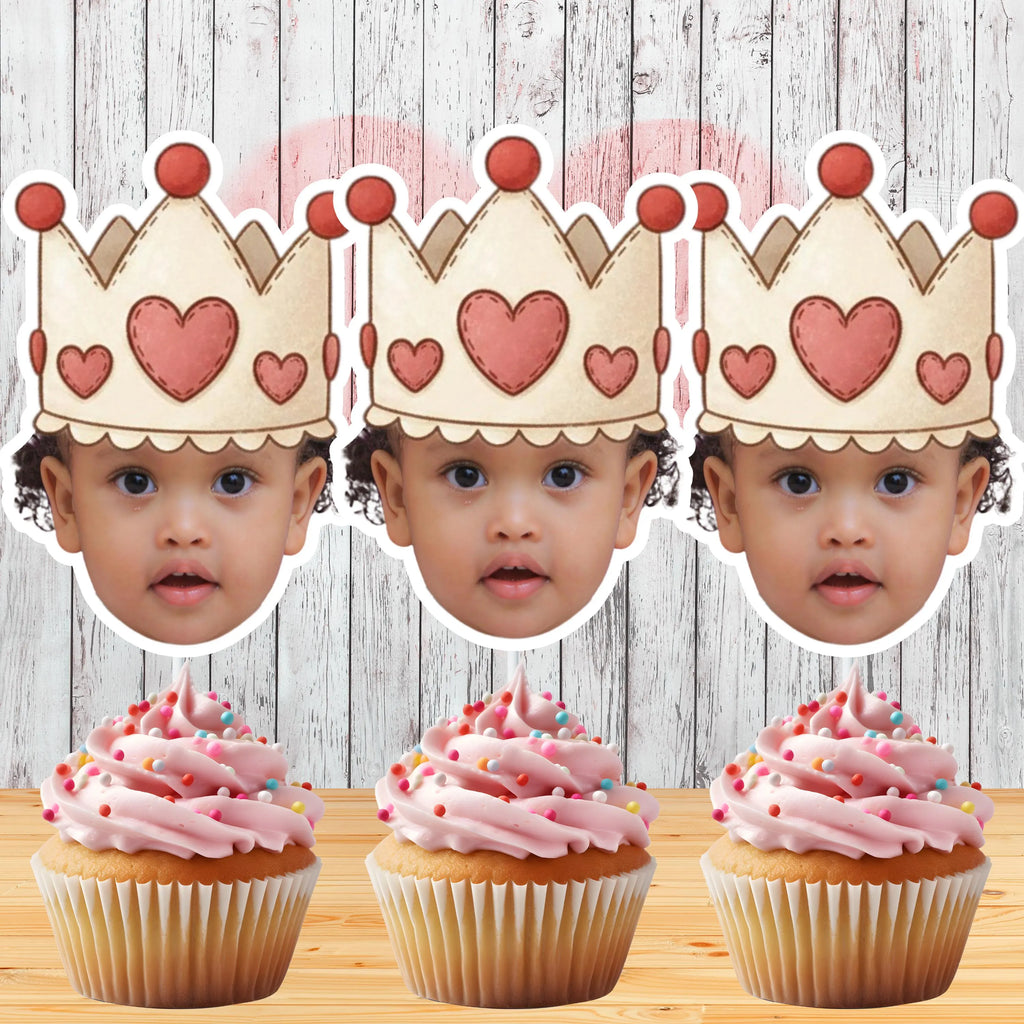 Personalized royal princess face cupcake toppers with heart crowns displayed on cupcakes with buttercream frosting. Custom photo birthday decorations perfect for Sweet 16 parties, Quinceañeras, baby showers, little princess birthdays, and elegant royal themed celebrations.