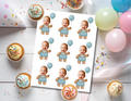 Printable sheet of nine personalized teddy bear photo cupcake toppers featuring a smiling baby’s face on a stuffed bear wearing blue overalls and holding a blue balloon
