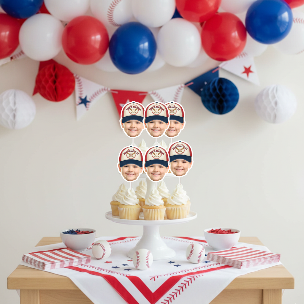 Vintage Rookie All-Star Baseball Cupcake Toppers personalized with child’s photo displayed on tiered dessert stand under red white and blue balloon garland for baseball birthday party decorations.
